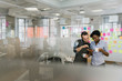 © FOLIO - Coworkers with smart phone