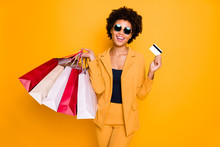 Portrait Of Positive Cheerful Dark Skin Shopper On Leisure Time Hold Credit Card Buy Many Bags Went Shopping Wear Style Pants Trousers Sunglass Isolated Over Yellow Color Background