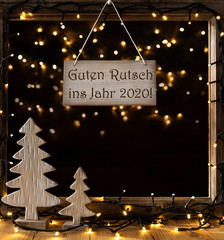 Wall Mural - Sign With German Text Guten Rutsch Ins Jahr 2018 Means Happy New Year 2018. Window Frame With Lights In The Night In Background. Christmas Decoration Like Christmas Tree And Fairy Lights.