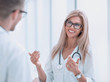 © ASDF - close up. woman doctor talking to colleague
