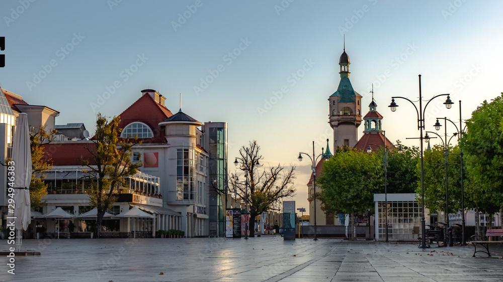 Beautiful architecture of Sopot with lighthouse and Monte Cassino street at morning, Poland. October. - obrazy, fototapety, plakaty 