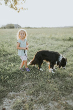 Girl Going Walkies With Dog In The Countryside