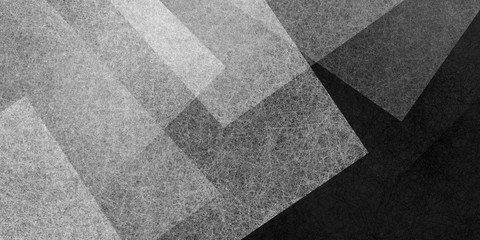 Abstract modern black and white background texture with white transparent textured triangle or block shapes in random geometric pattern that is contemporary trendy art style illustration