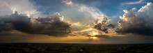Panorama Top View Aerial Photo From Flying Drone Over Village In Thailand.Top View Beautiful Sunset.Sunrise With Cloud Over Rice Field.