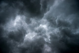 Dark sky and dramatic black cloud before rain.A tropical cyclone is a rapidly rotating storm system characterized by a low-pressure center, a closed low-level atmospheric circulation, strong winds.