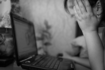 Woman working on laptop scene