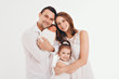 © aaalll3110 - family photo on a white background: parents spend time with their children. mom and dad hug the baby. the concept of childhood, fatherhood, motherhood, IVF