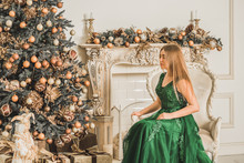 Christmas Or New Year Holidays Magical Atmosphere And Pretty Woman In Luxury Dress. Concept Of Celebrate