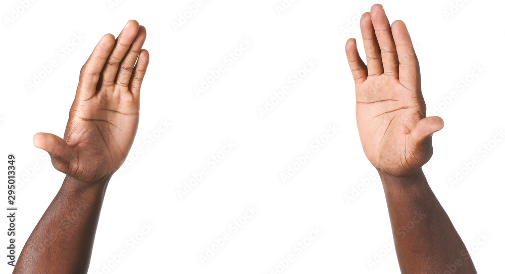 Hands of African-American man on white background