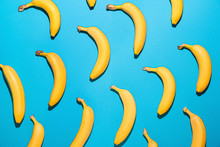 Ripe Bananas On Color Background