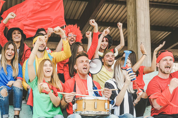 Friends football supporter fans watching soccer match event at stadium - Young people group having fun celebrating sport world championship game - Youth and entertainment concept