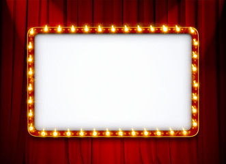 blank light sign frame on red theatre curtain