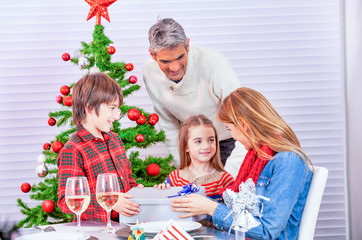 Sticker - Holidays and celebration concept - Happy family at home celebrating Christmas day