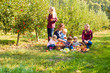 © oksix - Children and mothers picking apples on a farm in autumn. Healthy nutrition