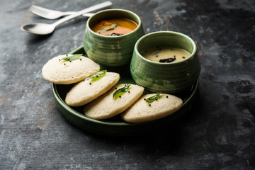 Sticker - Idli Sambhar or Idly Sambar is a popular south Indian food, served with coconut chutney. selective focus