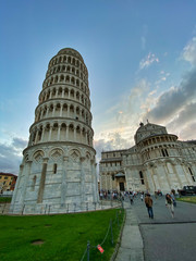 Poster - PISA, ITALY - SEPTEMBER 27, 2019: Field of Miracles at sunsetwith tourists