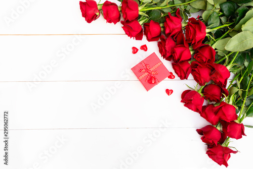 Red blooming roses on wood