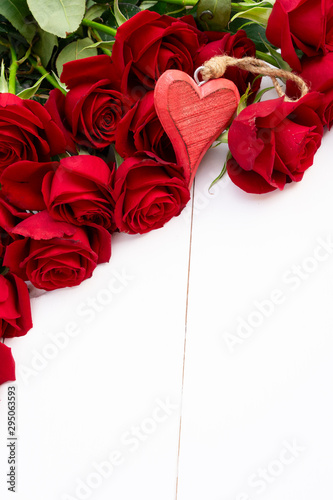 Red blooming roses on wood
