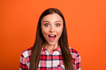 Poster - Close-up portrait of her she nice attractive cheery cheerful impressed glad content straight-haired girl wearing checked shirt good news isolated on bright vivid shine vibrant orange color background