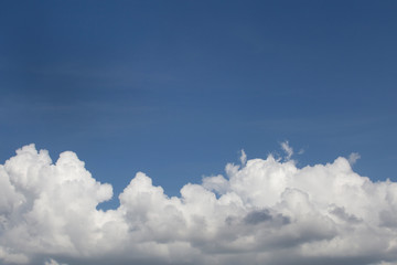 Wall Mural - white fluffy clouds in the blue sky