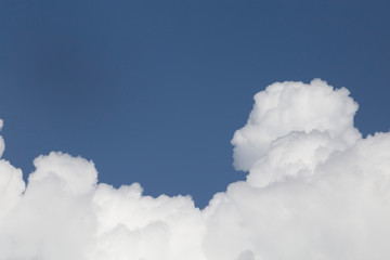 Wall Mural - white fluffy clouds in the blue sky