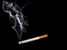 Close Up Of A Cigarette With Smoke Showing