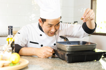 Asian Chef cooking in kitchen restaurant