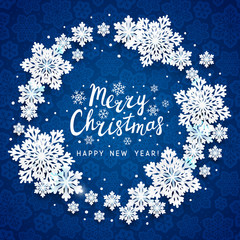 Wall Mural - Christmas greeting card with paper snowflakes round frame on blue background for Your holiday design