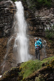 Fototapeta Łazienka - Beautiful female hiker at the waterfalls