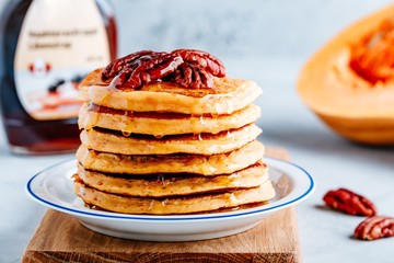 pumpkin pancakes with pecans and maple syrup or honey