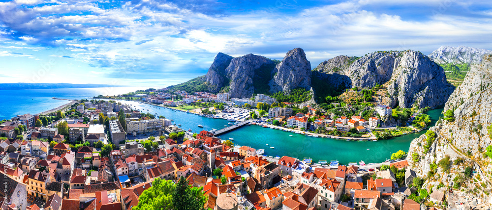 Landmarks of Croatia - impressive Omis town surrounded with gorges, over Cetina river - obrazy, fototapety, plakaty 