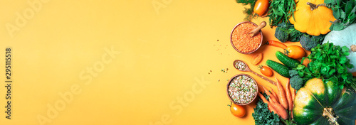 Cuadros en Lienzo Organic vegetables, lentils, beans, raw ingredients for cooking on trendy yellow background