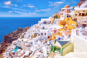 Wall Mural - Beautiful picturesque Oia village on Santorini island, Greece with traditional white architecture