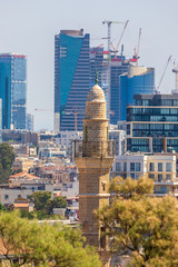 Wall Mural - The minaret of Mahmoudiya Mosque on modern buildings background