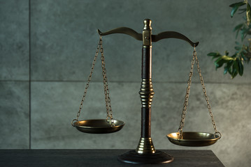 Law and Justice, judge gavel with scales on wooden table with blurred background.