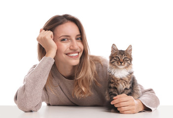 Young woman with cat on white background. Owner and pet