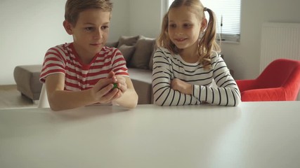 Wall Mural - Two happy children playing dices at home