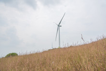 Vision View Of A Wind Turbine On A Hilltop Pasture In Autumn