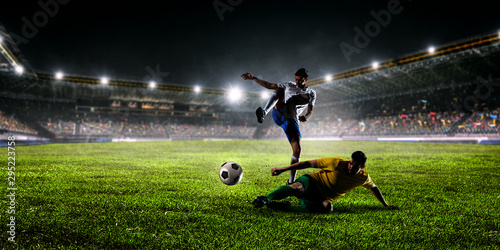 Soccer players on stadium in action