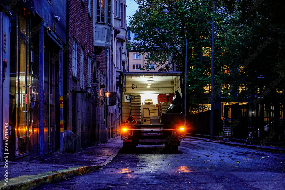 Stockholm, Sweden A delivery truck makes a delivery. - obrazy, fototapety, plakaty 