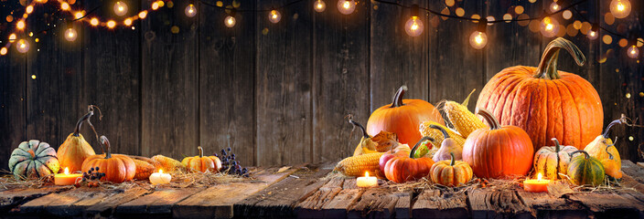 Wall Mural - thanksgiving - pumpkins and corncobs on rustic table