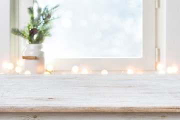 Wall Mural - blurred winter holiday background with vintage wooden table in front