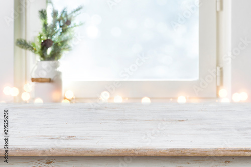 Cuadros en Lienzo Blurred winter holiday background with vintage wooden table in front