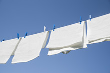 White Laundry Hanging On A String Outdoors