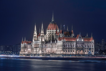 Wall Mural - Budapest, Hungary - The amazing illuminated Hungarian Parliament building by the River Danube at blue hour