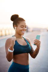 Wall Mural - Woman feeling happy after reaching her target in weight loss