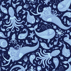 Wall Mural - Vector seamless nautical fairy tale pattern. Fantasy mermaid, octopus, fish, sea animals blue silhouette with ornaments on a dark indigo background. Batik, wallpaper, textile print, wrapping paper