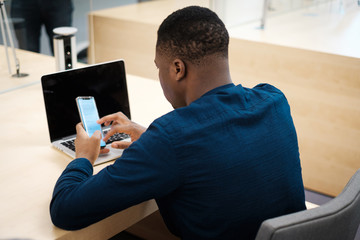 Young man studying in public library