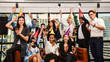 © Somchai - Business men and women with glasses of champagne celebrating Christmas and New Year for success in Business at the Office