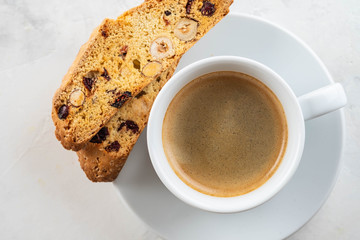 Wall Mural - Christmas homemade cookies biscotti with dry berries and cup of coffee. Copy space.